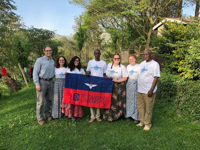 photo of group in student group and hosts in Tanzania
